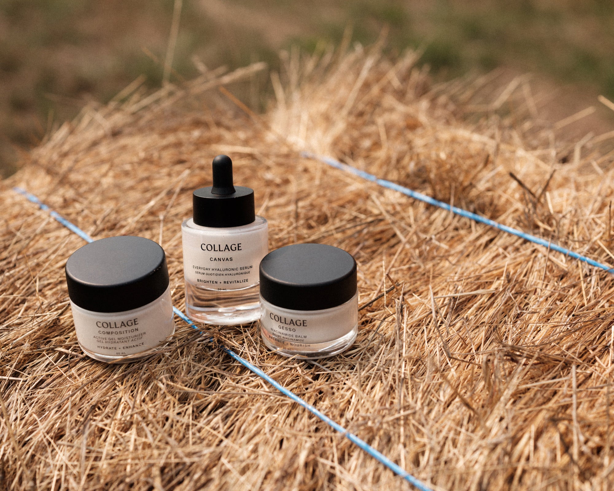 Three Collage skincare products on a hay bale with a natural background
