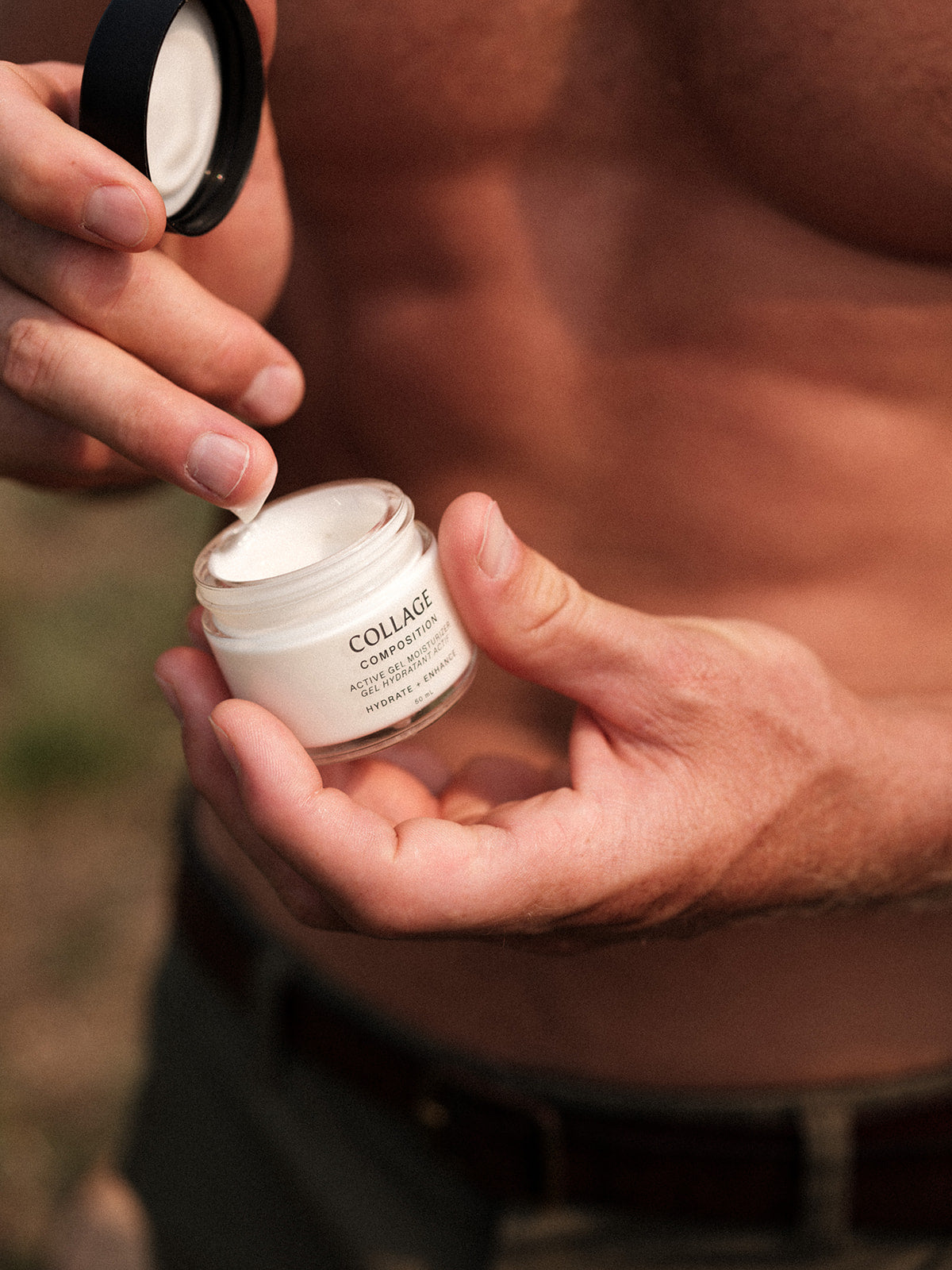 Person holding a jar of Collage Skincare Cream with a blurred background